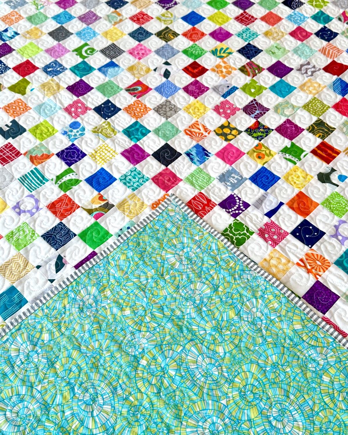 Large scrappy quilt with front and back detail