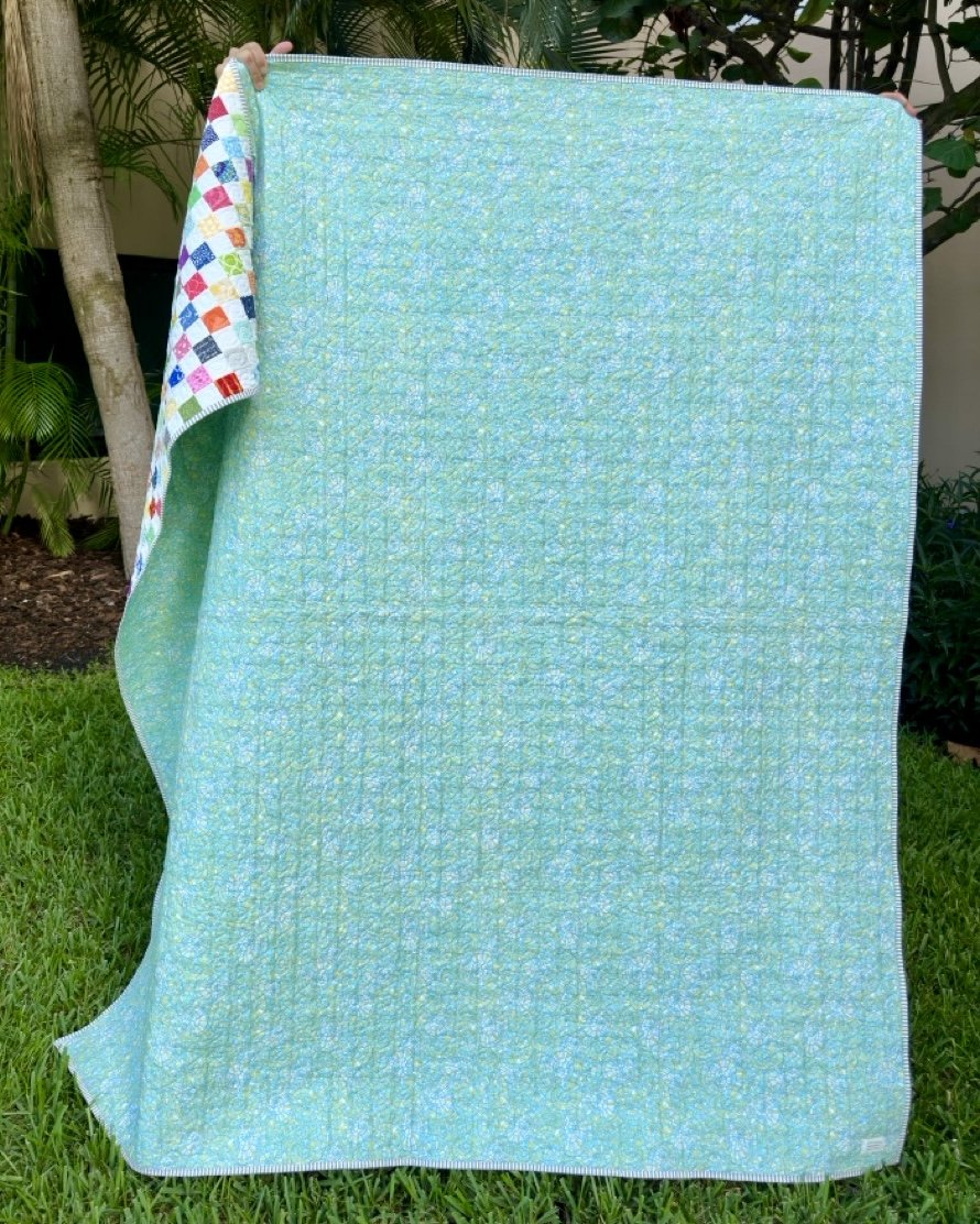 Back of large scrappy quilt