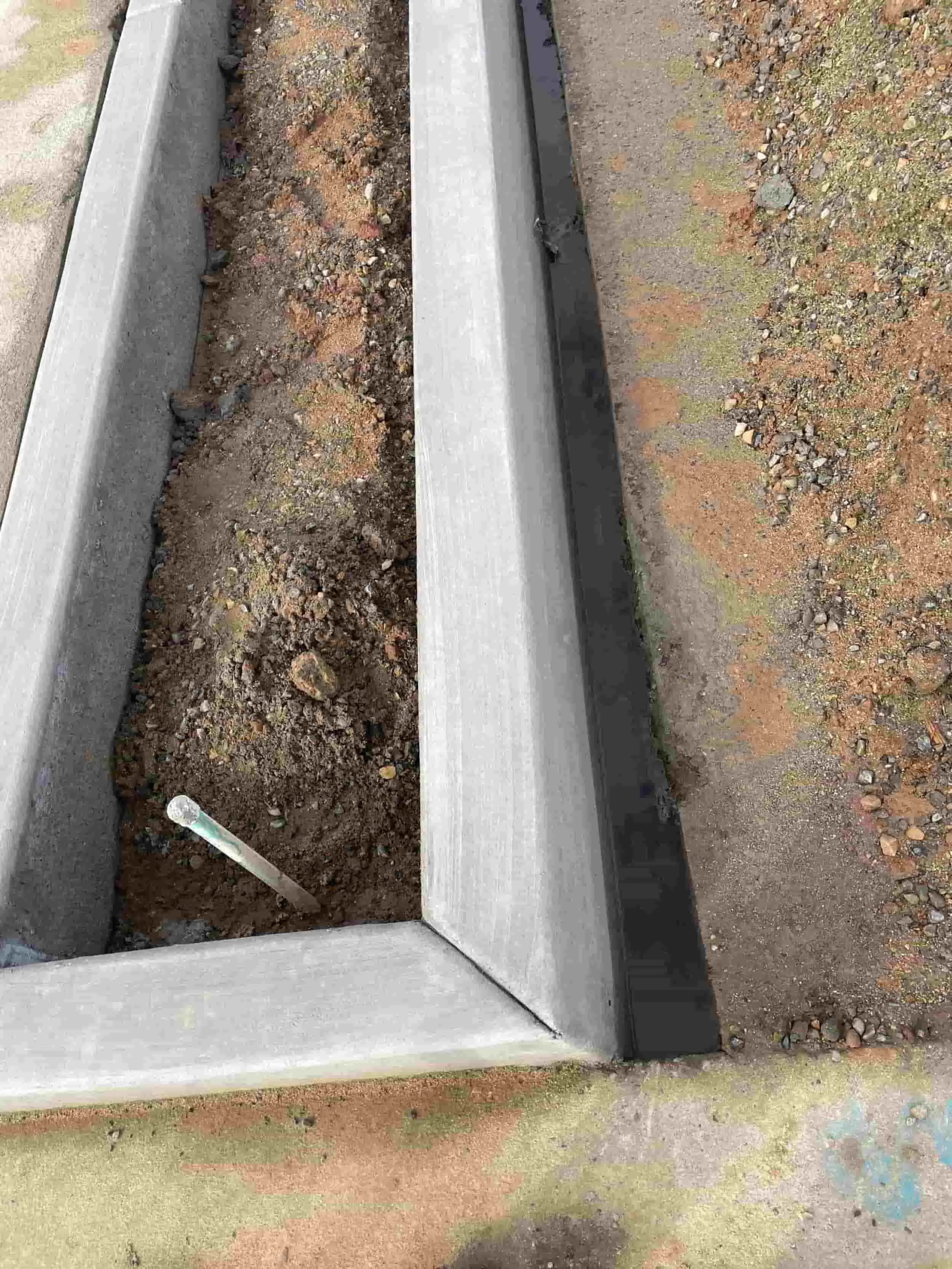 Freshly poured concrete curbing