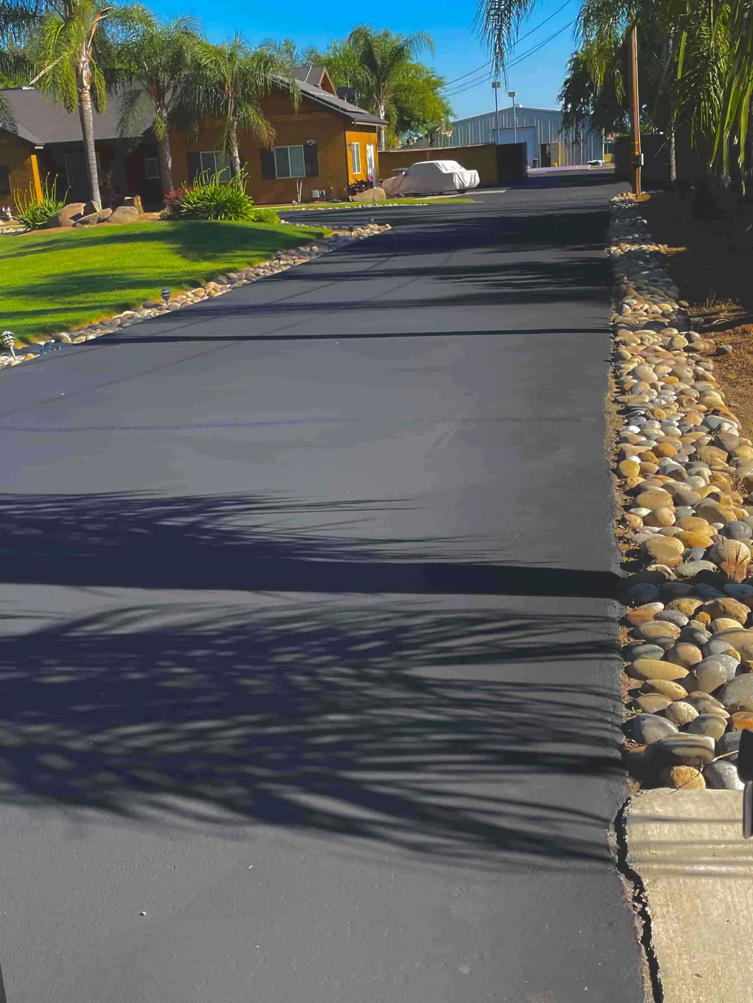 driveway seal coated and asphalt repaired in fresno