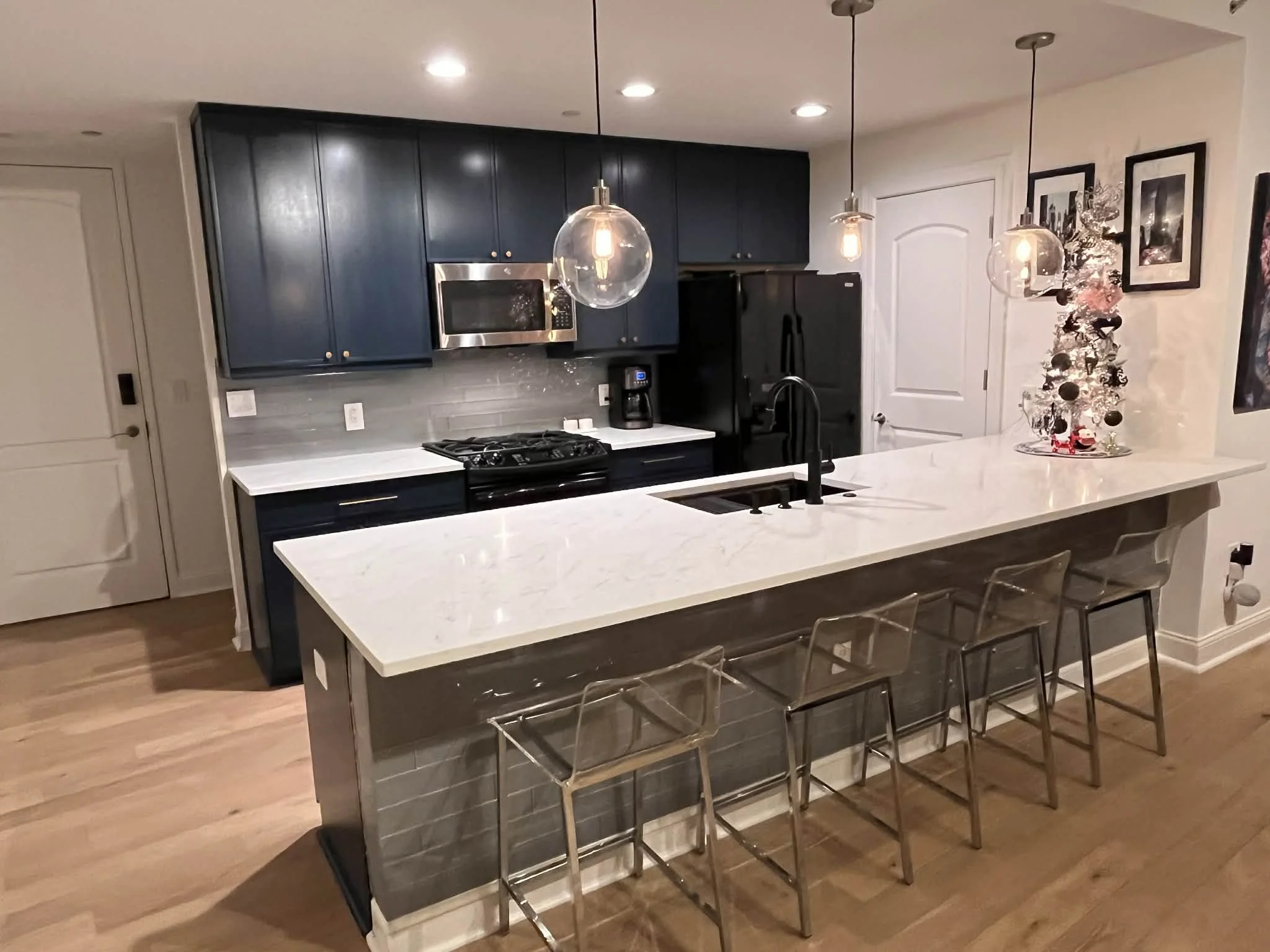 Photo of a kitchen with newly replaced island, countertops, and cabinets in Charlotte, North Carolina