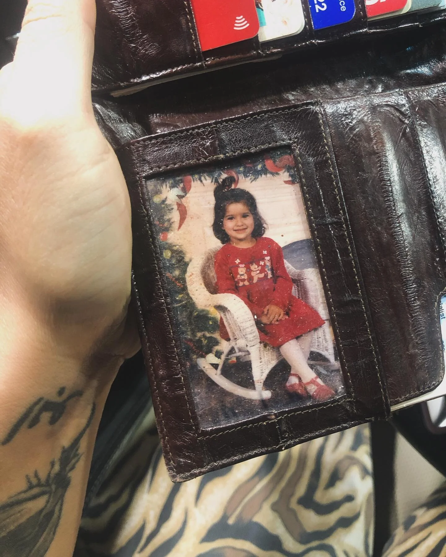 My dads wallet 🫶🏽 
.
remember when people carried photos in their wallets? I do. 
.
I found this photo while we were road tripping up to Washington from California. It was something I used to see everyday when I was growing up. Funny how little mom