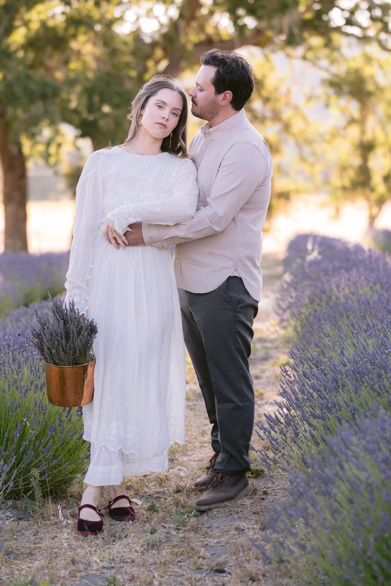 Golden hour wedding portraits overlooking vineyards and rolling hills in Paso Robles wine country