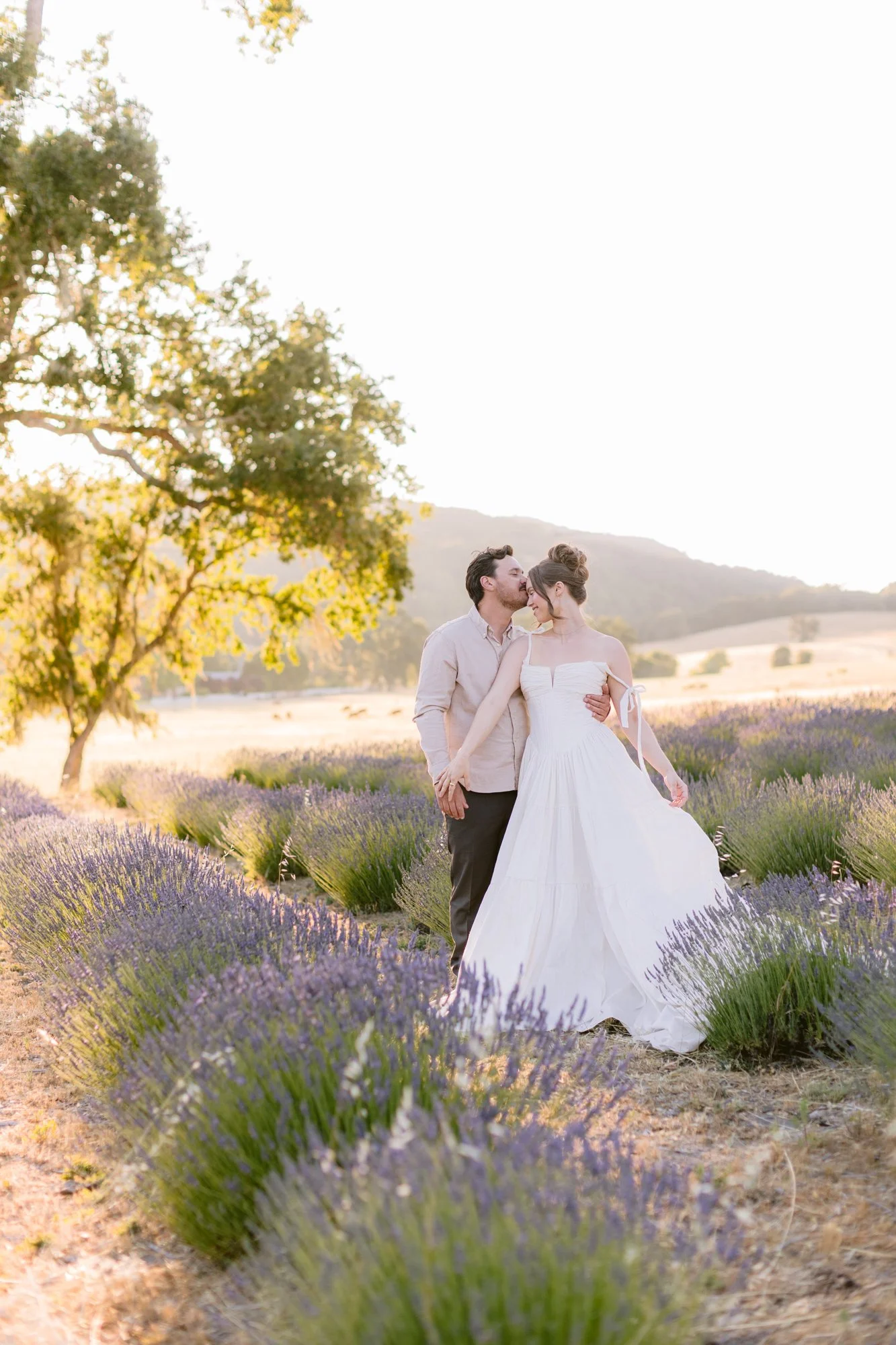 Intimate wedding cake cutting during a private farm elopement experience