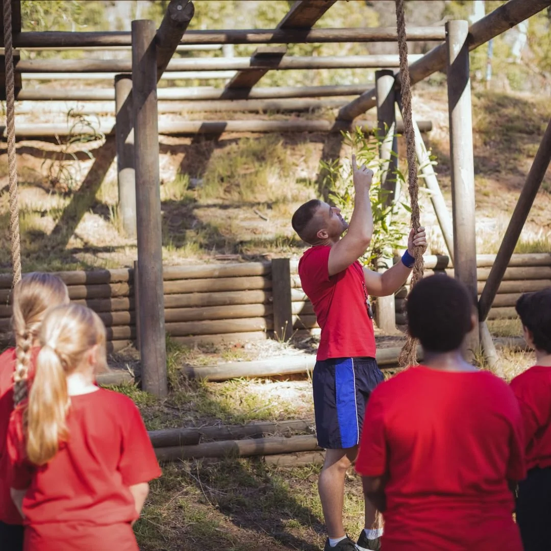 Young Instructure explaining climbing rope