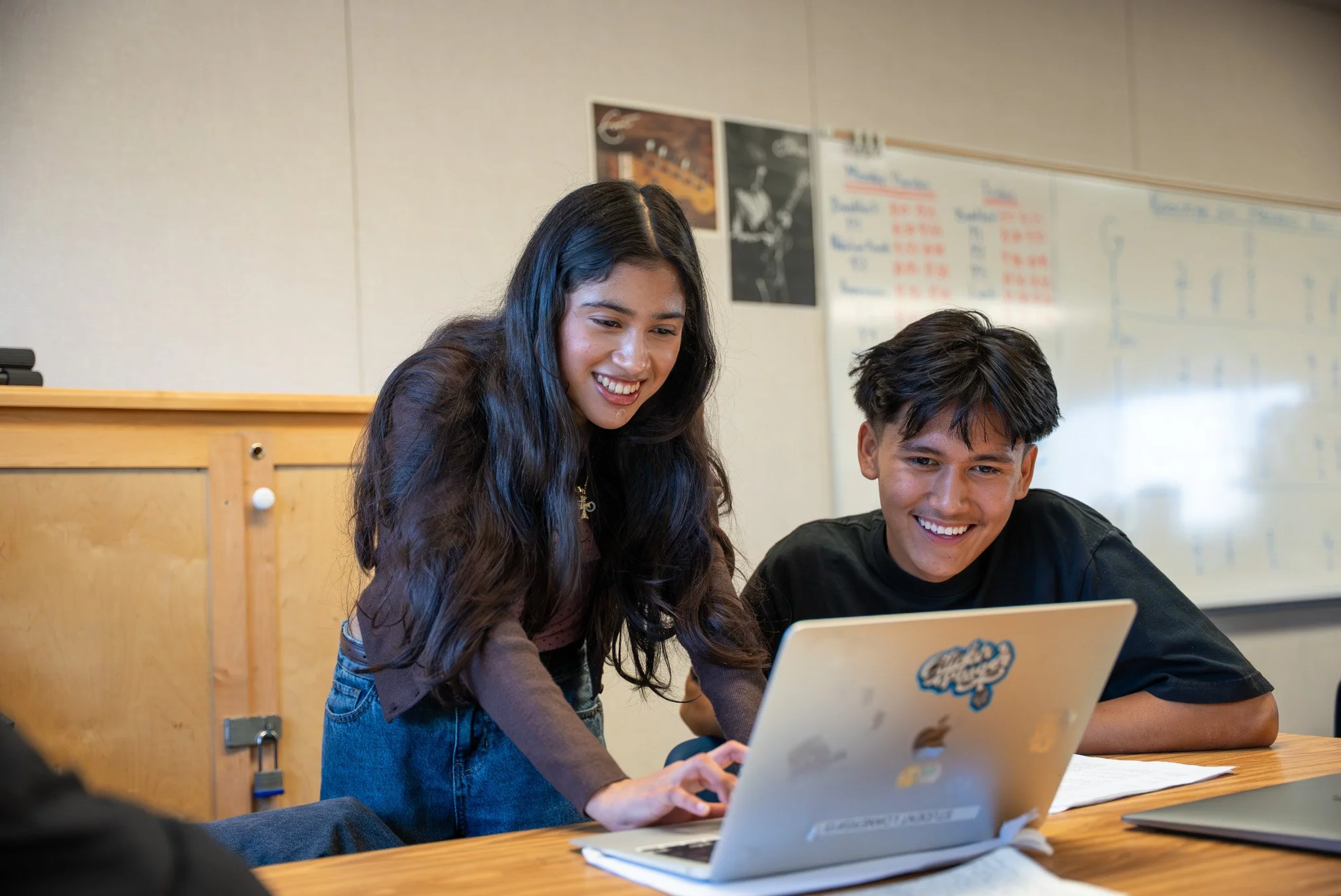 Teacher working with student