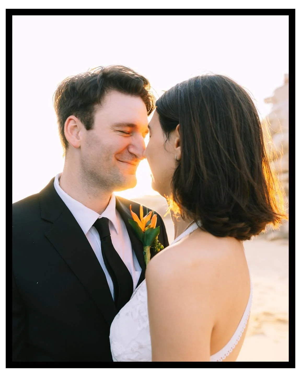 The sun melted softly into the horizon as Cassidy and Evan walked along Pedregal&rsquo;s golden shore &mdash; barefoot, unhurried, held by the wind.
There was no rush, no grandeur, only the quiet grace of two souls choosing each other again beneath t