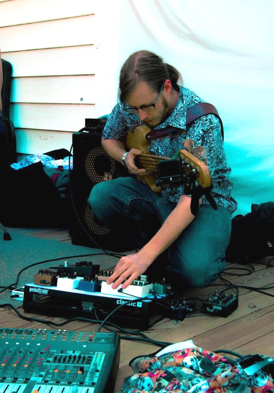 Olas Ortwein setting up pedal board in Denton, TX - 2018