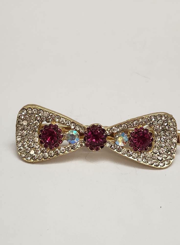 bow gold dk pink.jpeg