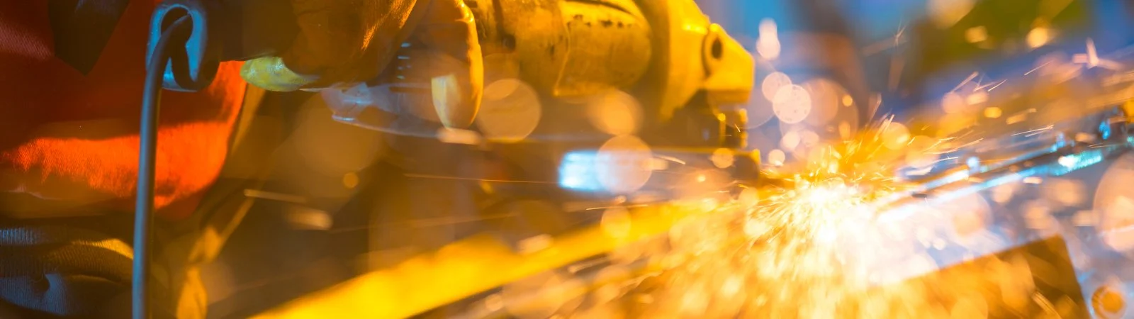 Out of focus sparks fly around an indistinguishable machine