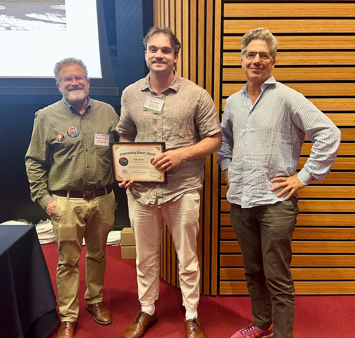 Outstanding Poster Award goes to Riley Kane, North Carolina State University, with Ron and Kent