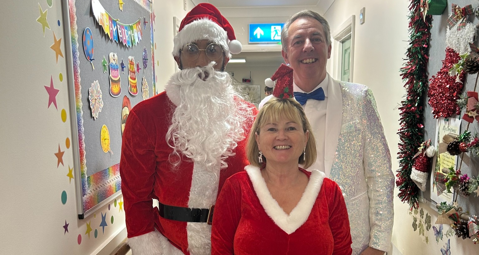 3 people at christmas time