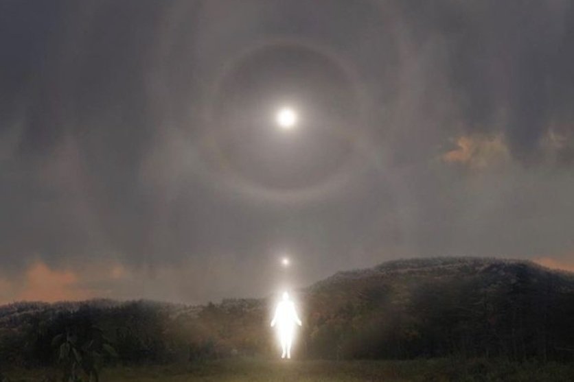 Astrology, moon, spiritual, ritual, ceremony, priestess
A person standing outdoors at night with the moon overhead, surrounded by a halo, and bright reflections or orbs aligned vertically above them.