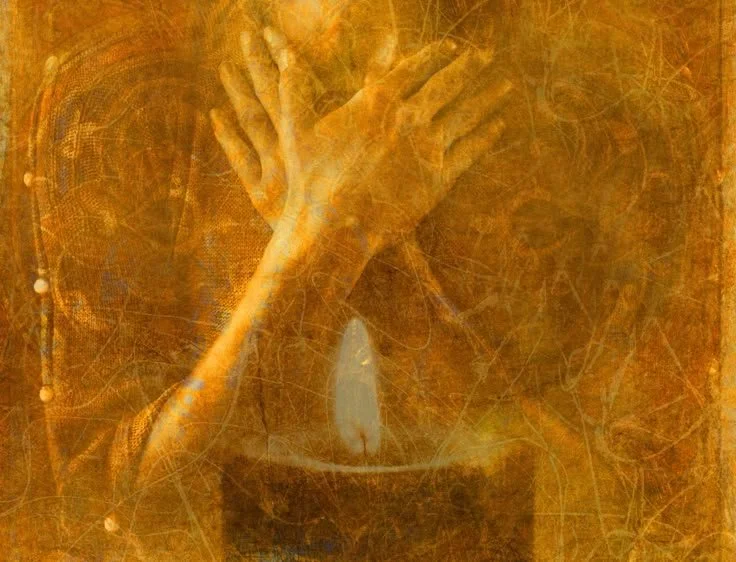 A framed artwork depicting a pair of hands crossed over each other, set against a textured warm-toned background.