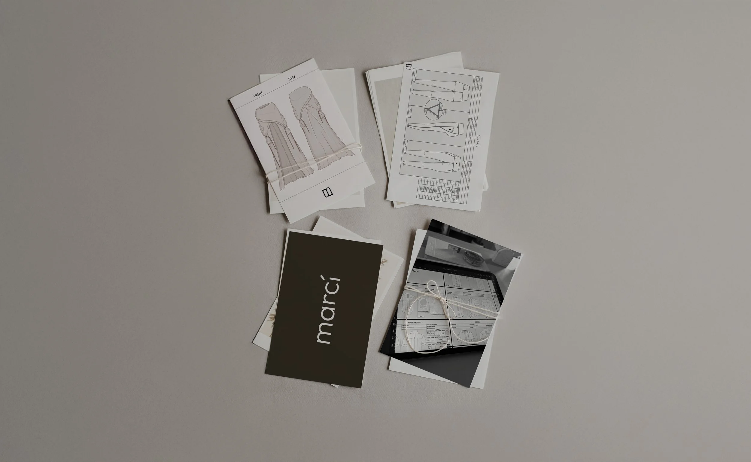 Fashion design tech pack showing flat sketches, points of measure, size page and bill of materials for garment manufacturing