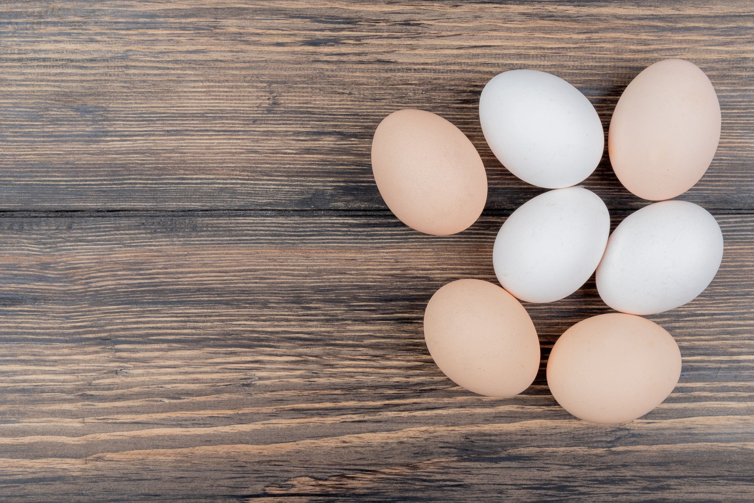 top-view-chicken-eggs-isolated-wooden-background-with-copy-space.jpg