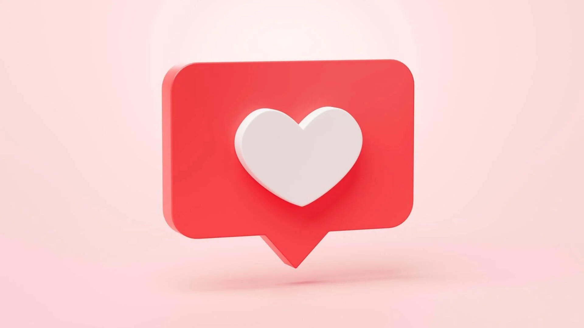 White-colored heart inside a message bubble