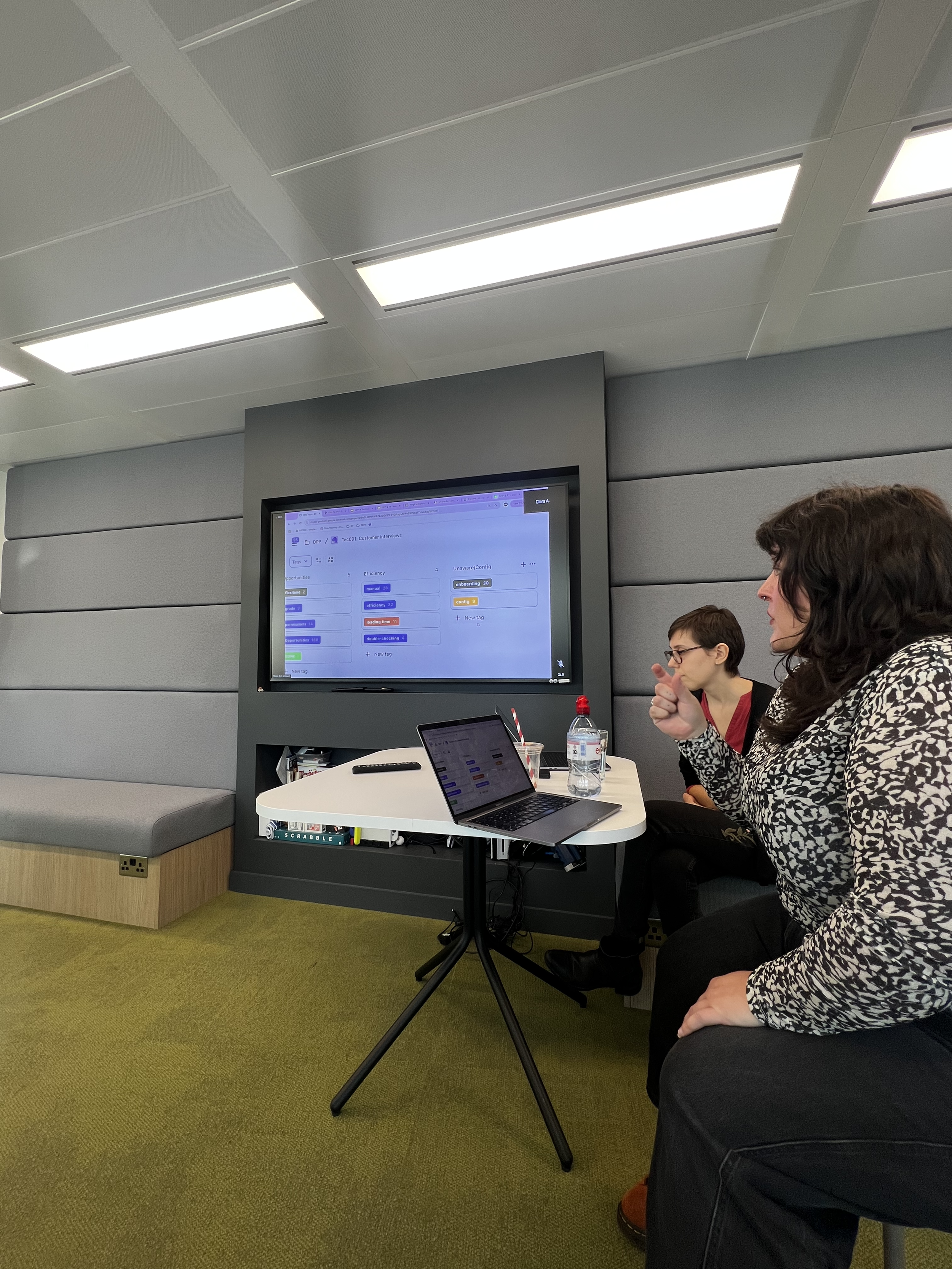 Picture of two people presenting in an office