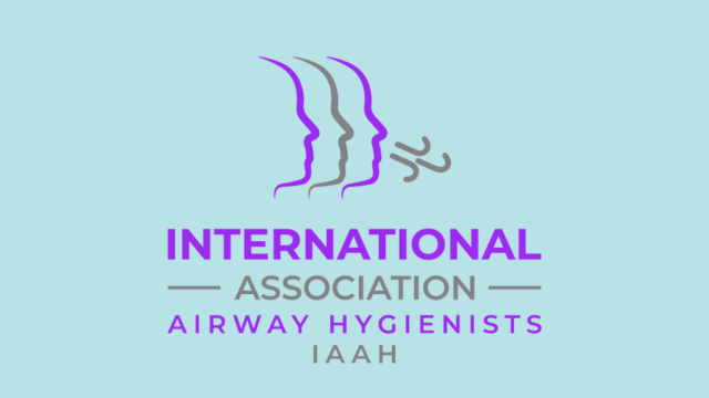 Logo of the International Airway Hygienists (IAAH) with stylized faces and text in purple and gray on a light blue background.