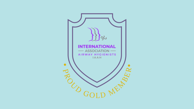 Logo for the International Airway Association Hygienists, featuring a shield with a stylized airplane and text, on a light blue background.
