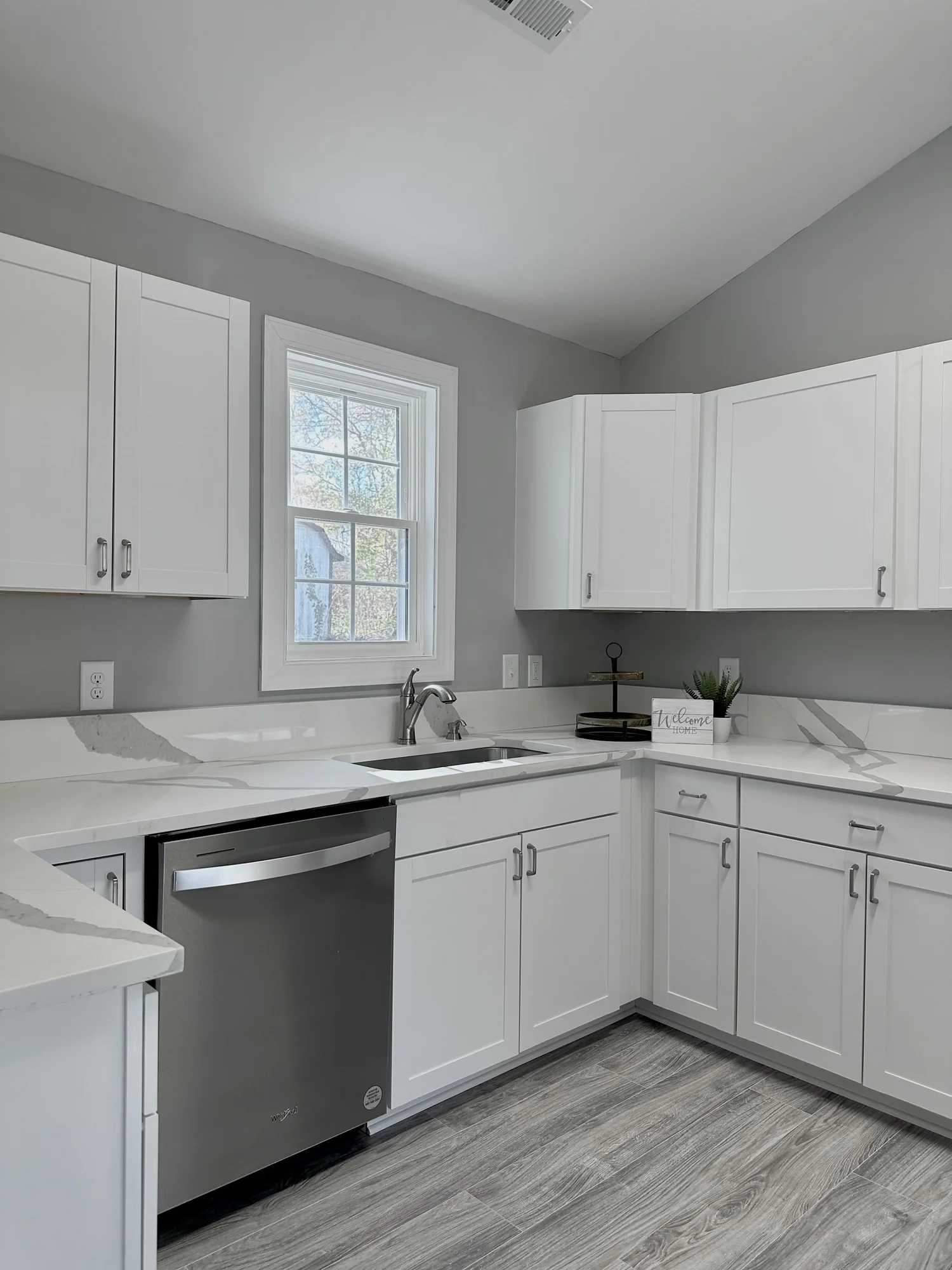 Compact white kitchen with bright countertop