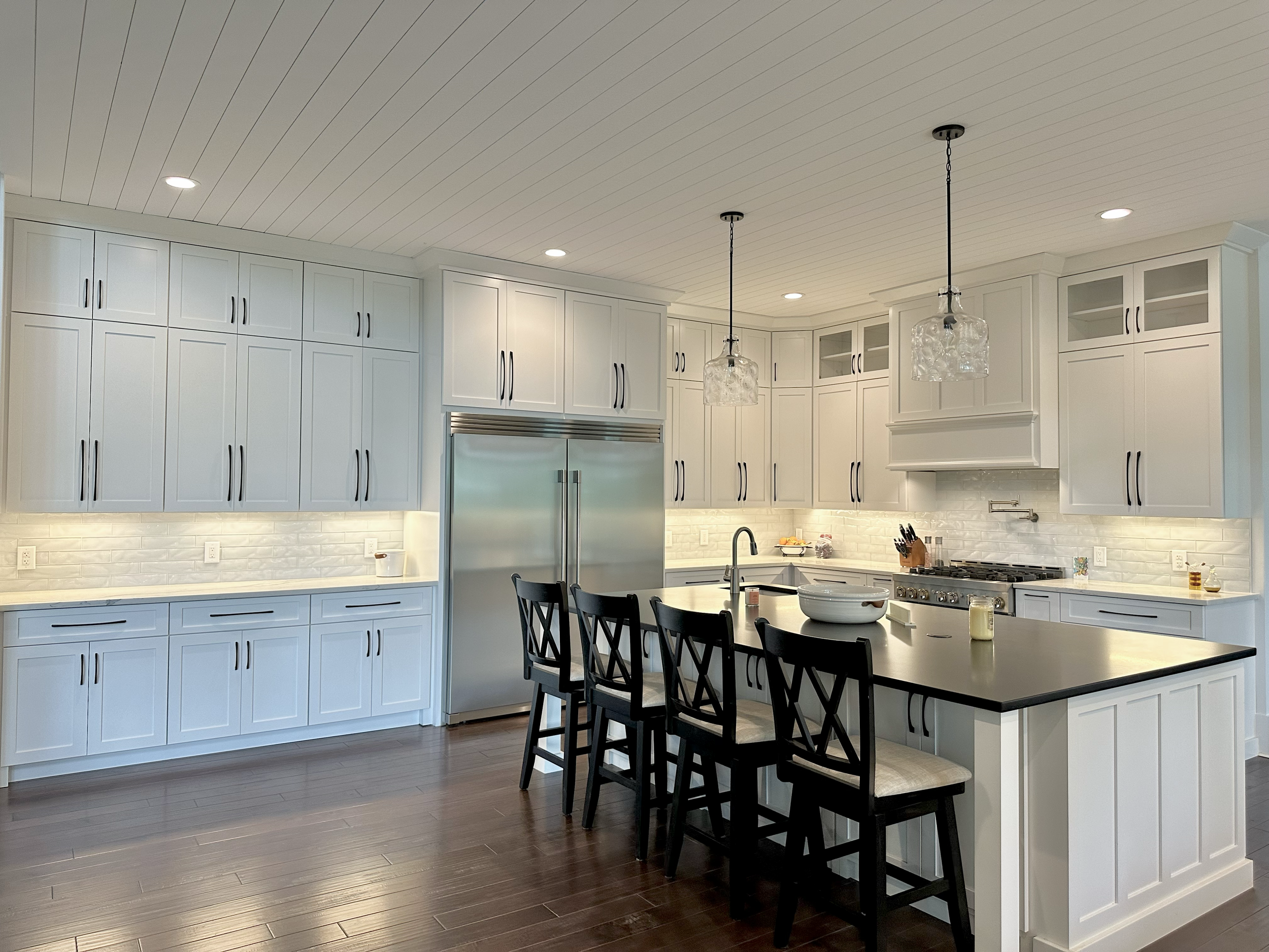 Large bright kitchen with a long island and pendant lighting