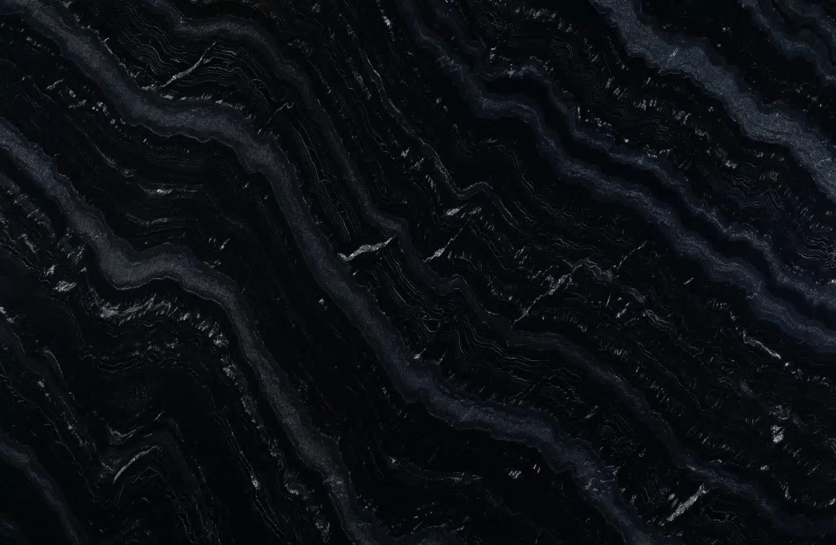 Full slab of Agatha Black granite with white and gray flowing veins