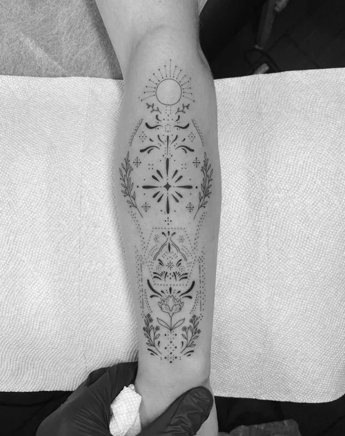 Ornamental fine-line tattoo