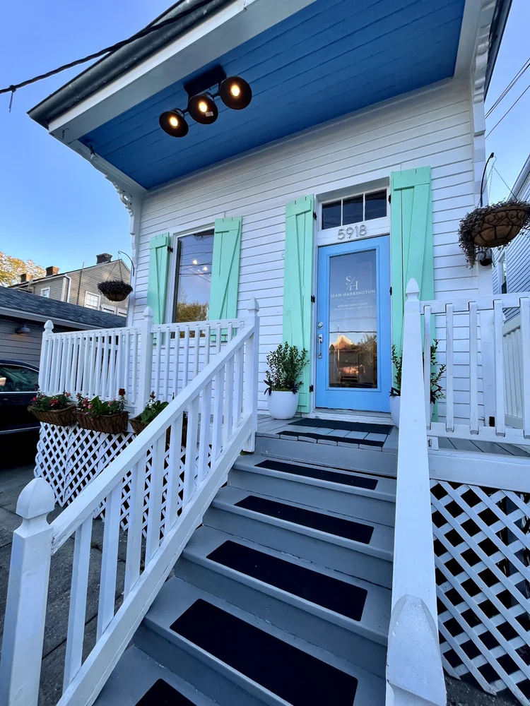 Studio porch and blue door at 5918 Magazine Street
