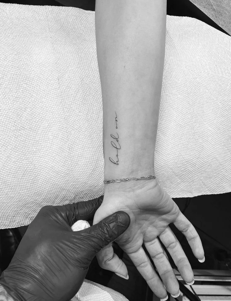 Lettering fine-line tattoo