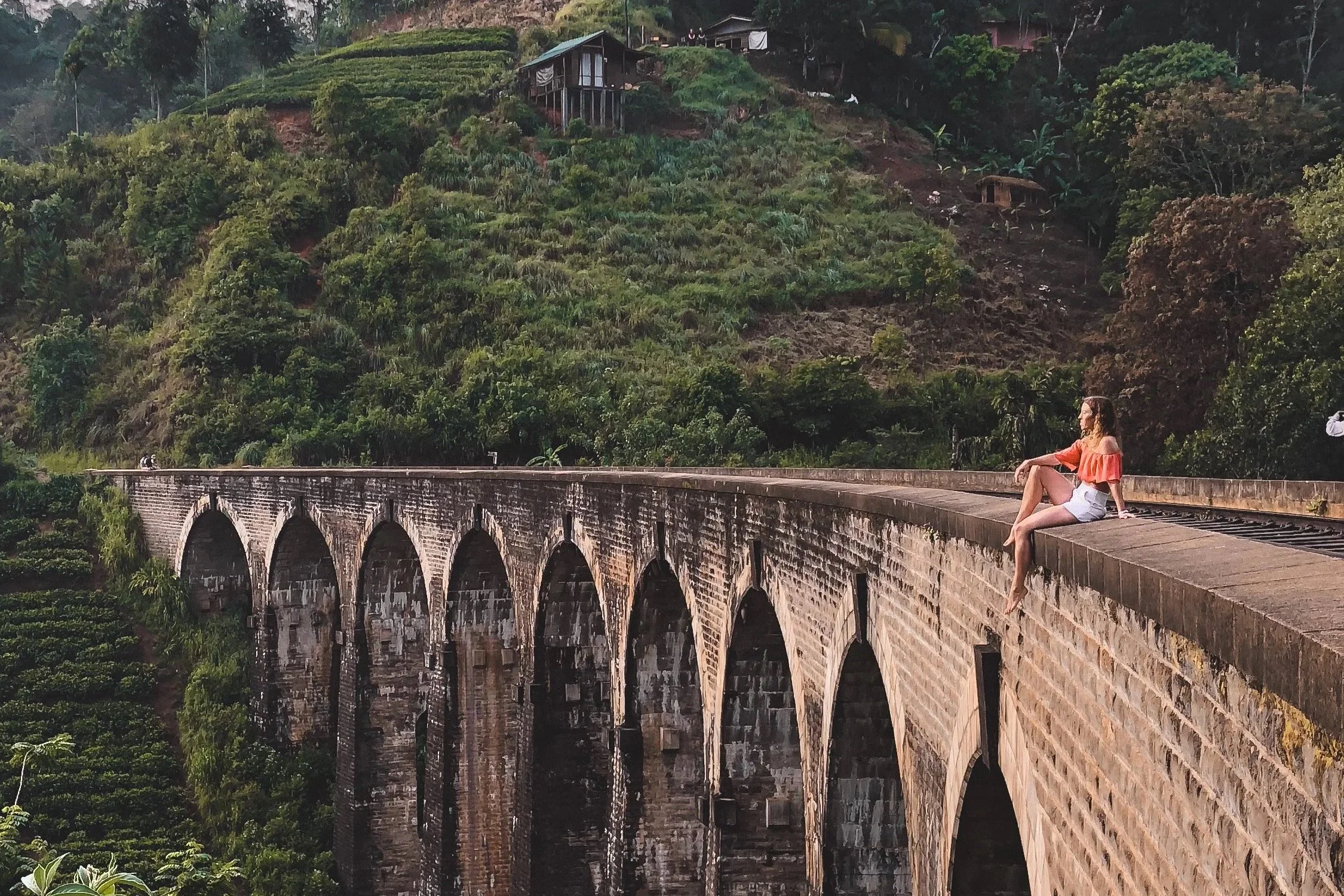 Solo travel in Ella, Sri Lanka, sitting on Nine Arches Bridge