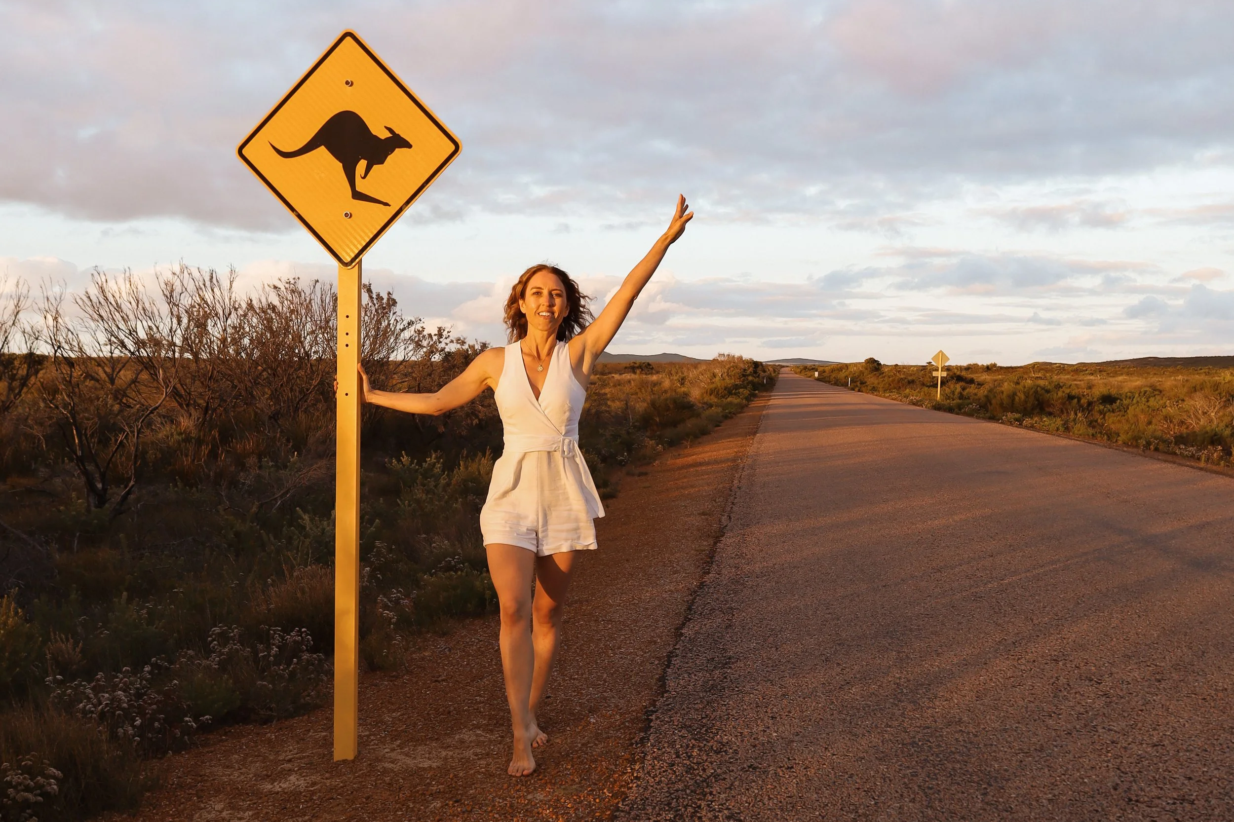 Standing on a road with a kangaroo sign in Western Australia