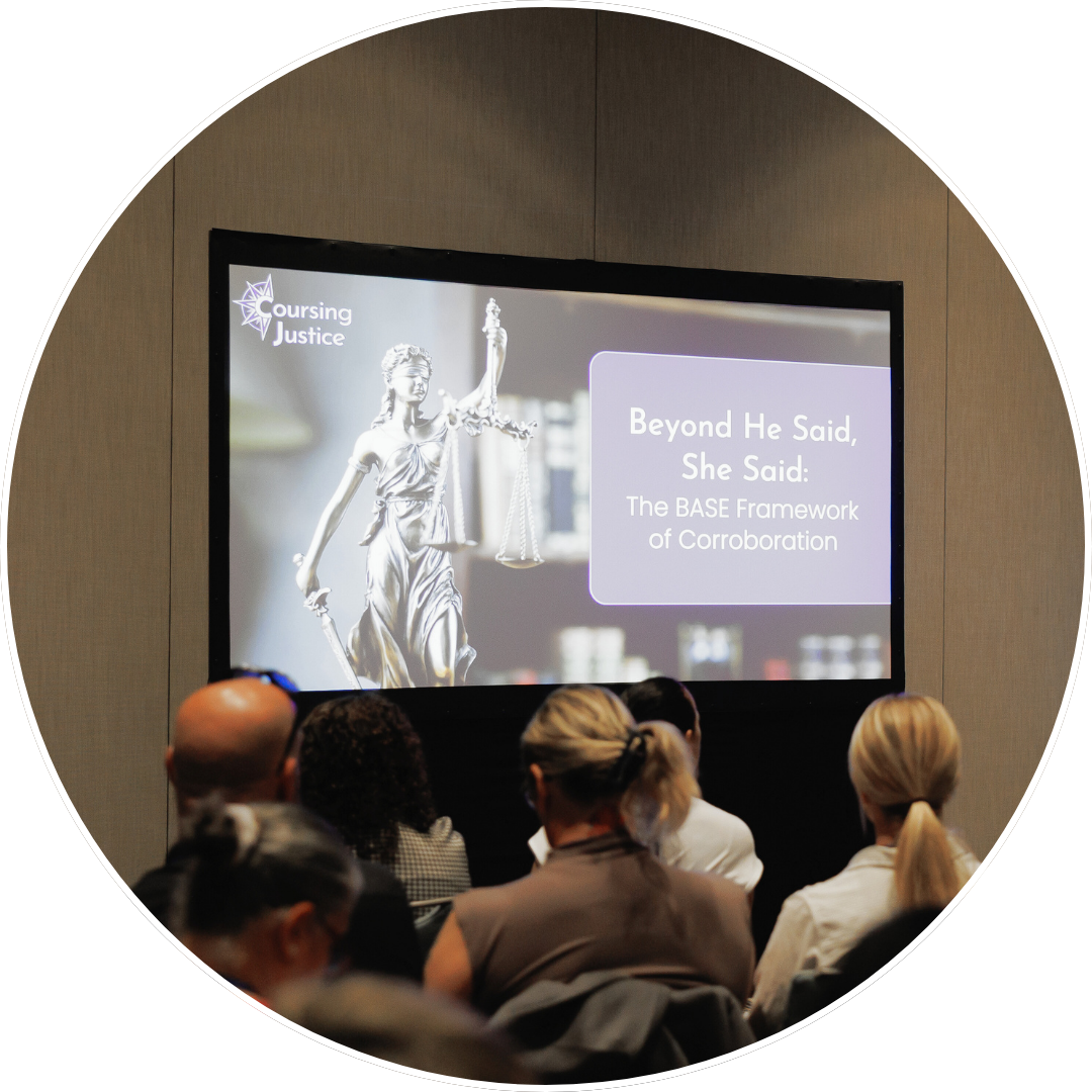 Audience seated and watching a training presentation displayed on a large screen in a conference setting.