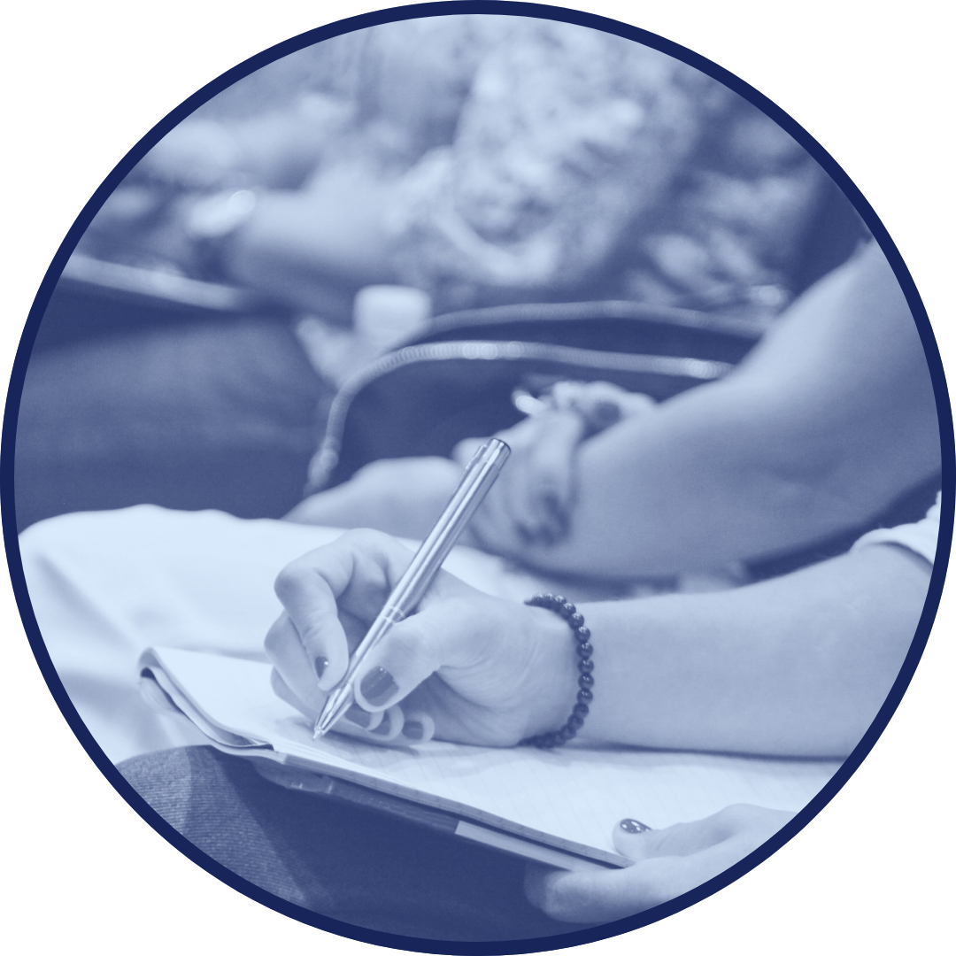 Participant taking notes during an in-depth, classroom-style training session.