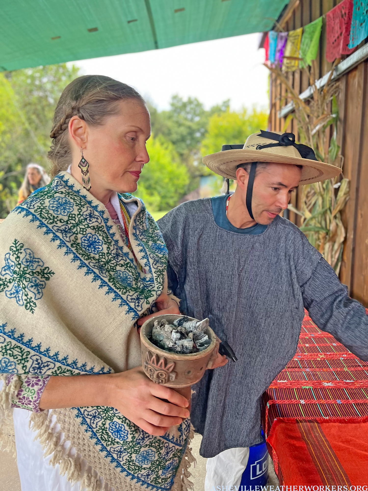 3b-Asheville-Traditional-Weather-Harvest-Festival-ceremony-2022-Asheville-weather-workers-Erin-Adam-preparing-altar-the-village-healers.png