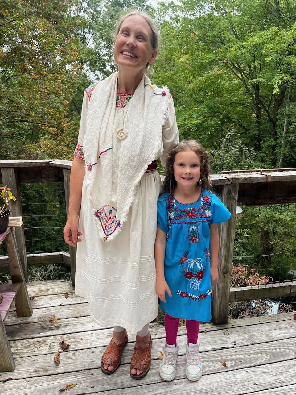 202610-Erin-with-Ada-harvest-festival-ceremony-way-of-the-dove-asheville-nc.jpg