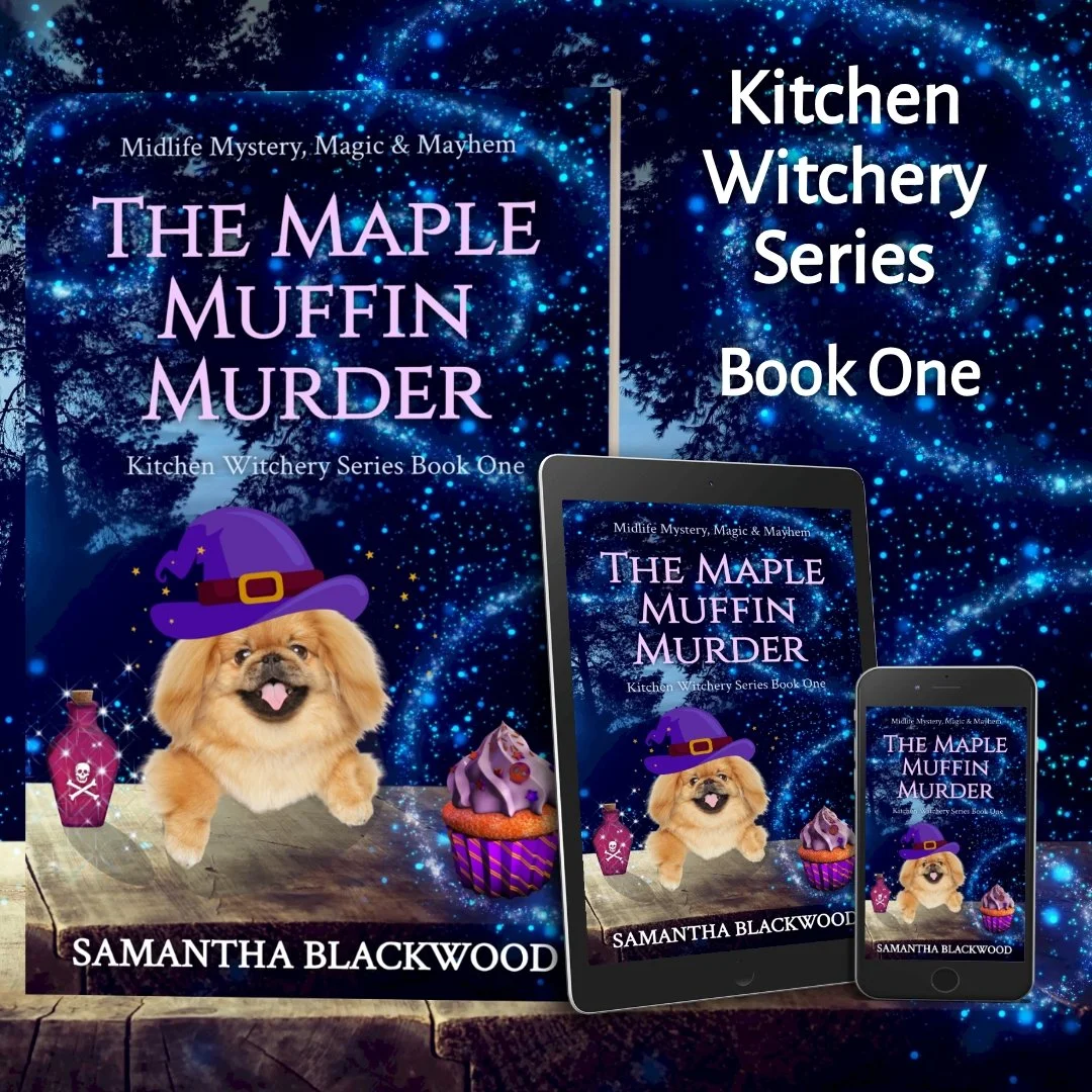 Cover images of the book 'The Maple Muffin Murder' by Samantha Blackwood, featuring a small puppy, cupcakes, and potion bottles on a wooden surface with a starry blue background. The cover is shown on a large poster, a tablet, and a smartphone.