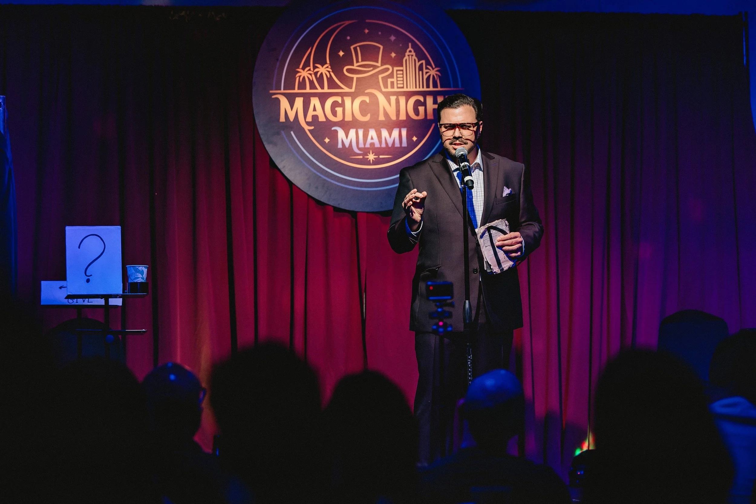 Michael Andrew performing for an audience onstage at Magic Night Miami.