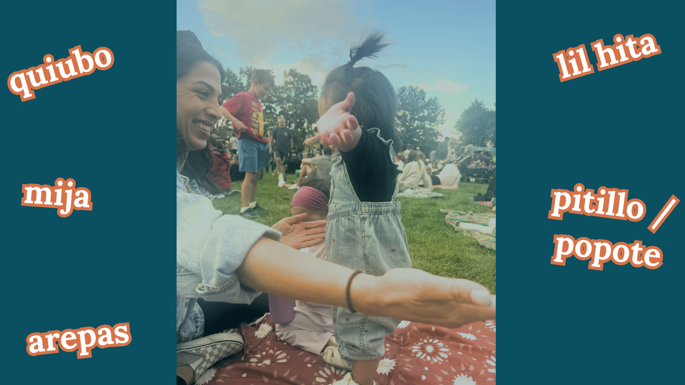 A woman smiling and sitting on a blanket outdoors, interacting with a young girl whose face is covered by her hair tied in a ponytail, with other children and people in the background on a grassy field.