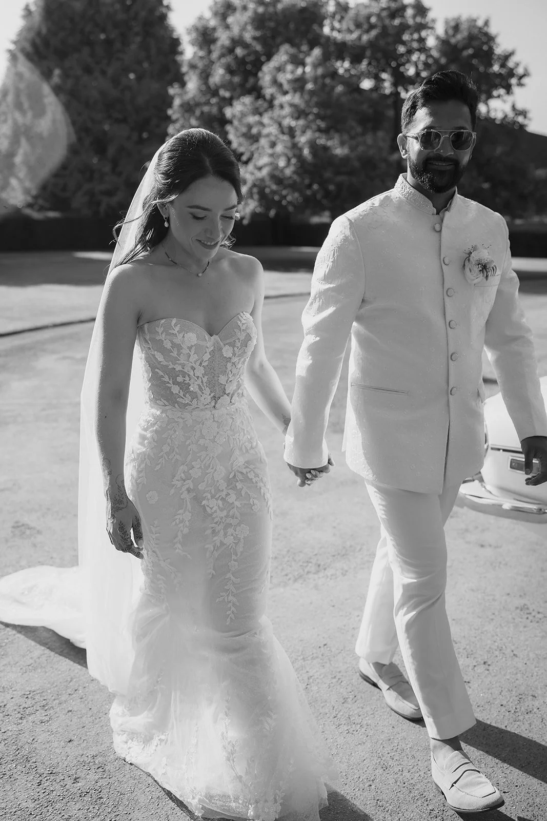 bride and groom walking hand in hand at north cadbury court