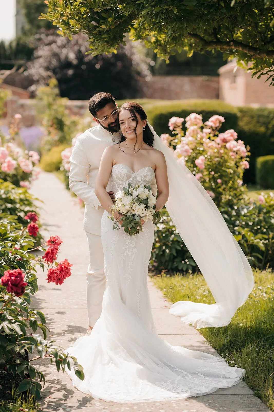 Bride and groom in the rose garden at north cadbury court