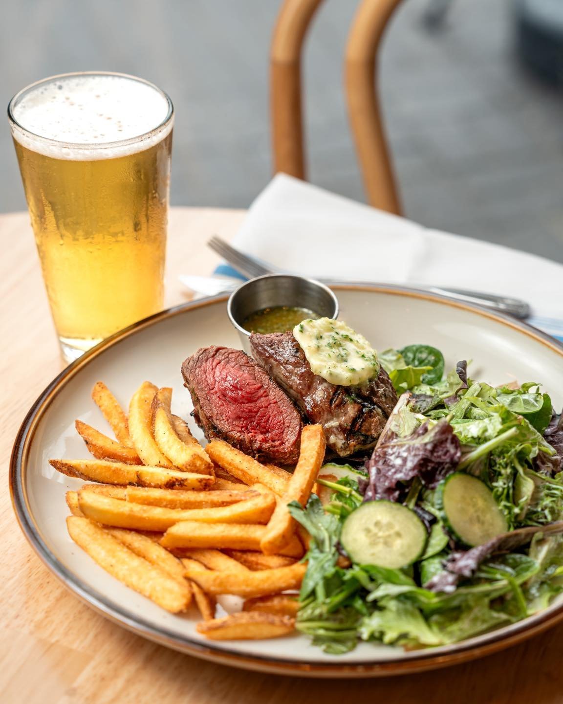 We've refreshed our Steak Frites, and trust us, you're going to want to give this dish a try! 

We're using a very tender teres major cut, with a texture similar to a filet mignon. Topped with our Chef's Chevy Main Steakhouse Butter, our new Steak Fr