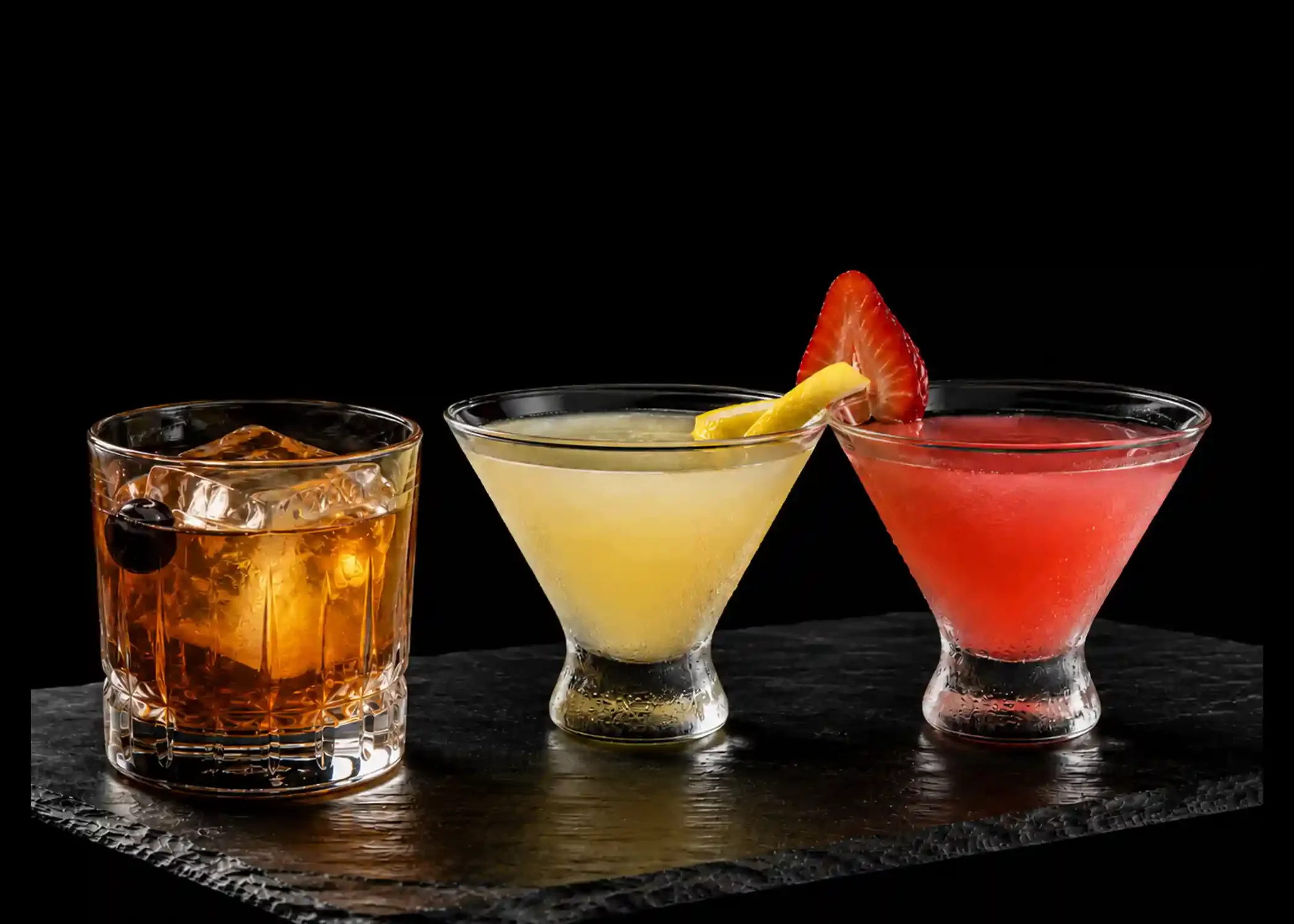 Old fashioned and lemon drop martinis served on black slate at Mito Hibachi & Sushi in Warren, Michigan.