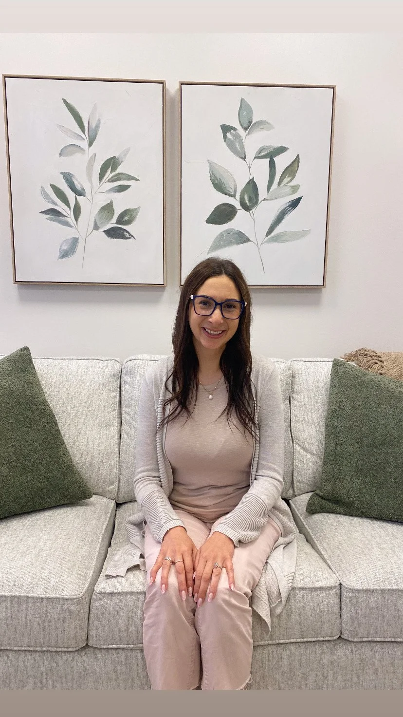 Megan Ivancic smiling during a selfie at the Perinatal Trauma Centre and Therapy offices located in Sherwood Park. 