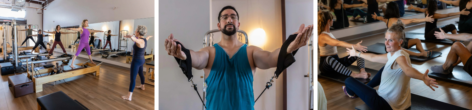 Group of women in a Pilates class doing stretches on mats in a studio, with an instructor demonstrating, and a man in the center holding resistance bands with arms outstretched.