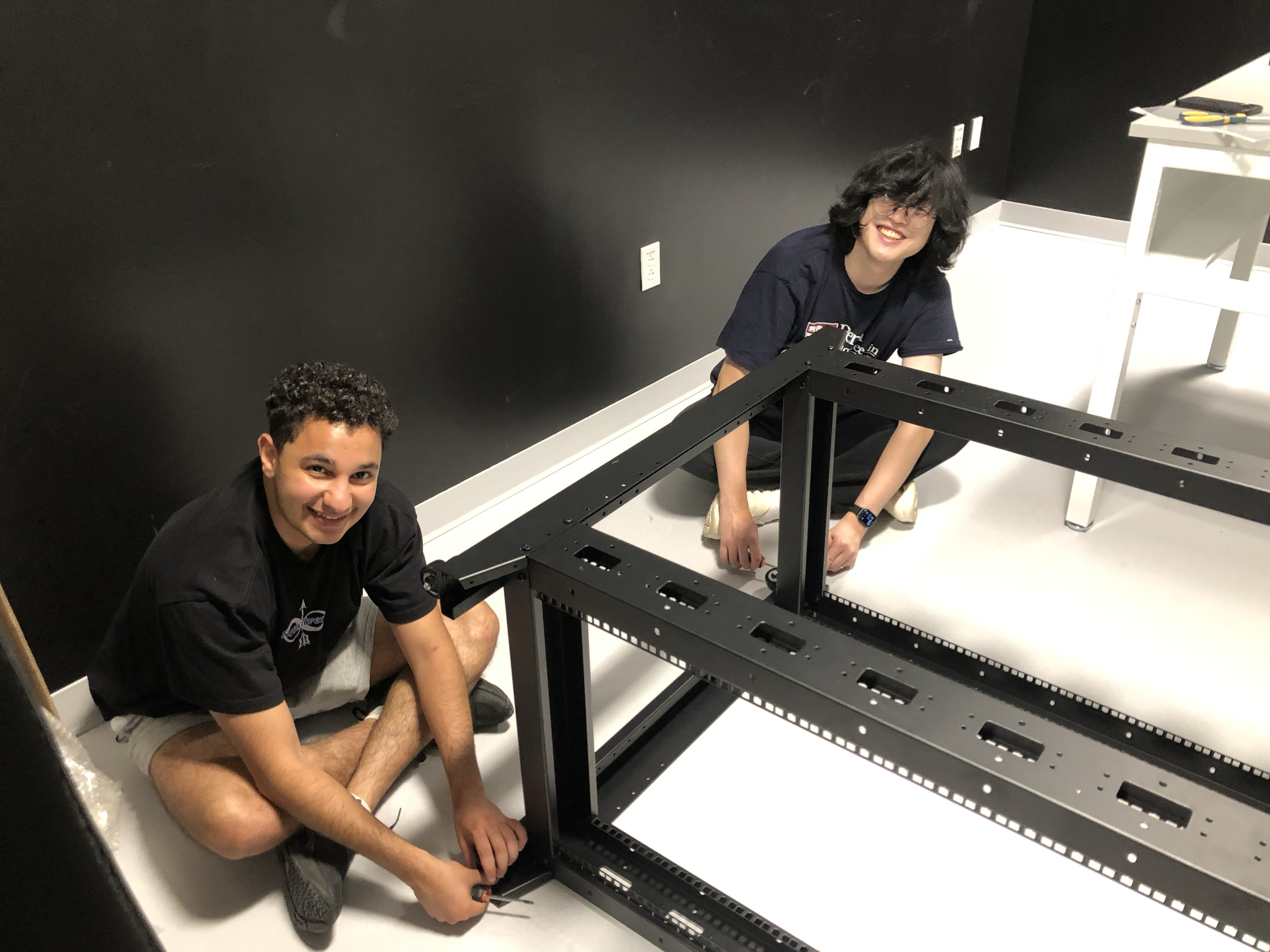John and Jiazhen working in the optics room - July 2024