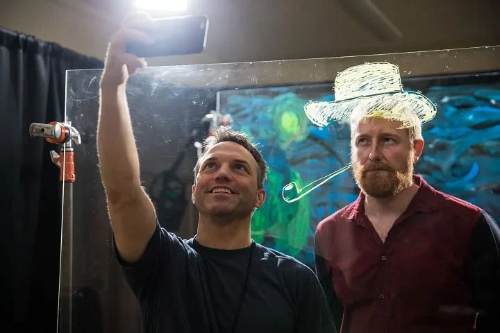 Asa Mathat takes a selfie with Hugh Welchman