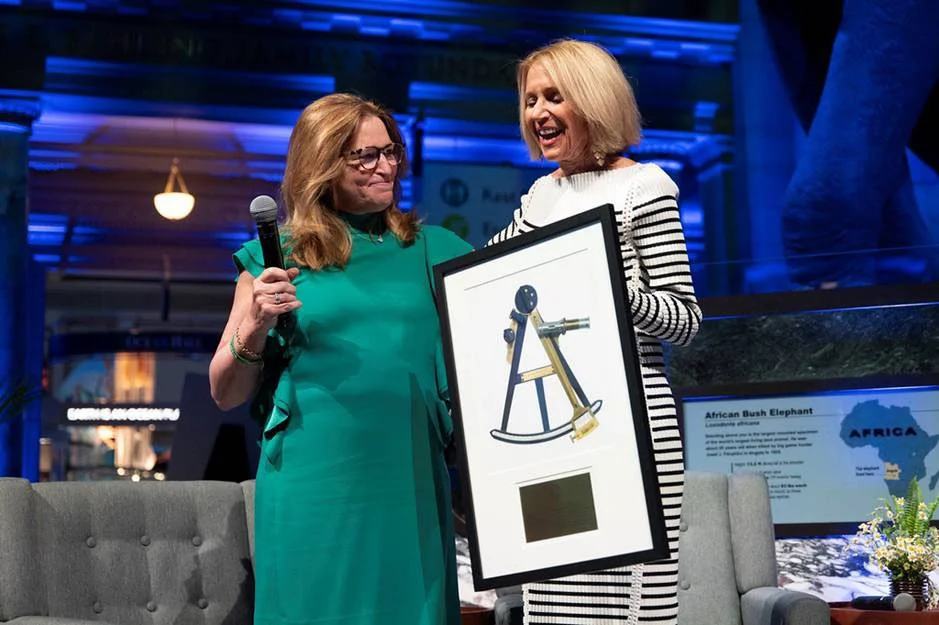 National Academy of Sciences President Marcia McNutt receives a reproduction of a national treasure from Ellen Stofan, Under Secretary for Science and Research, Smithsonian Institution.