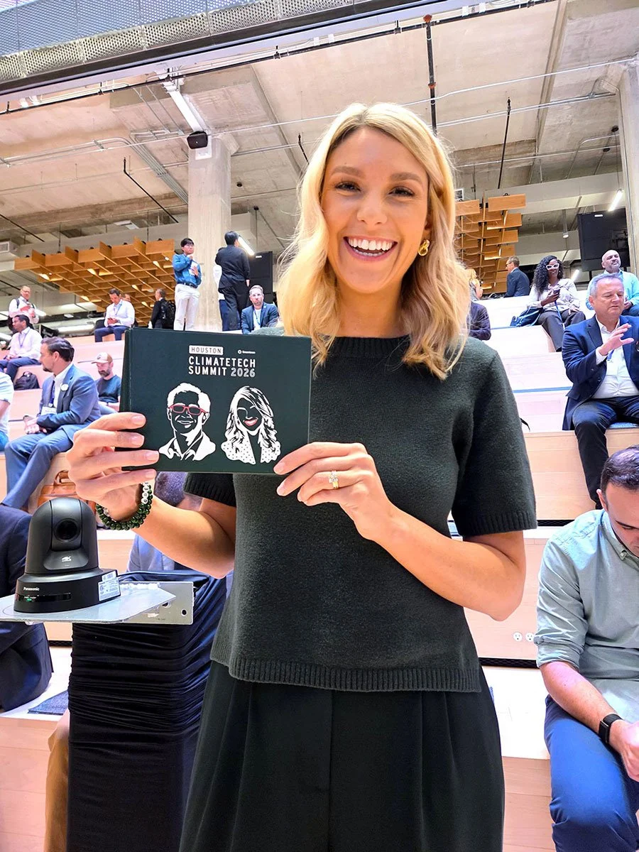 Greentown's Houston Head, Kelsey Kearns in forest green sweater holds the cue cards with portraitstencil-like portraits of her and her co-host, Neal Dikeman.