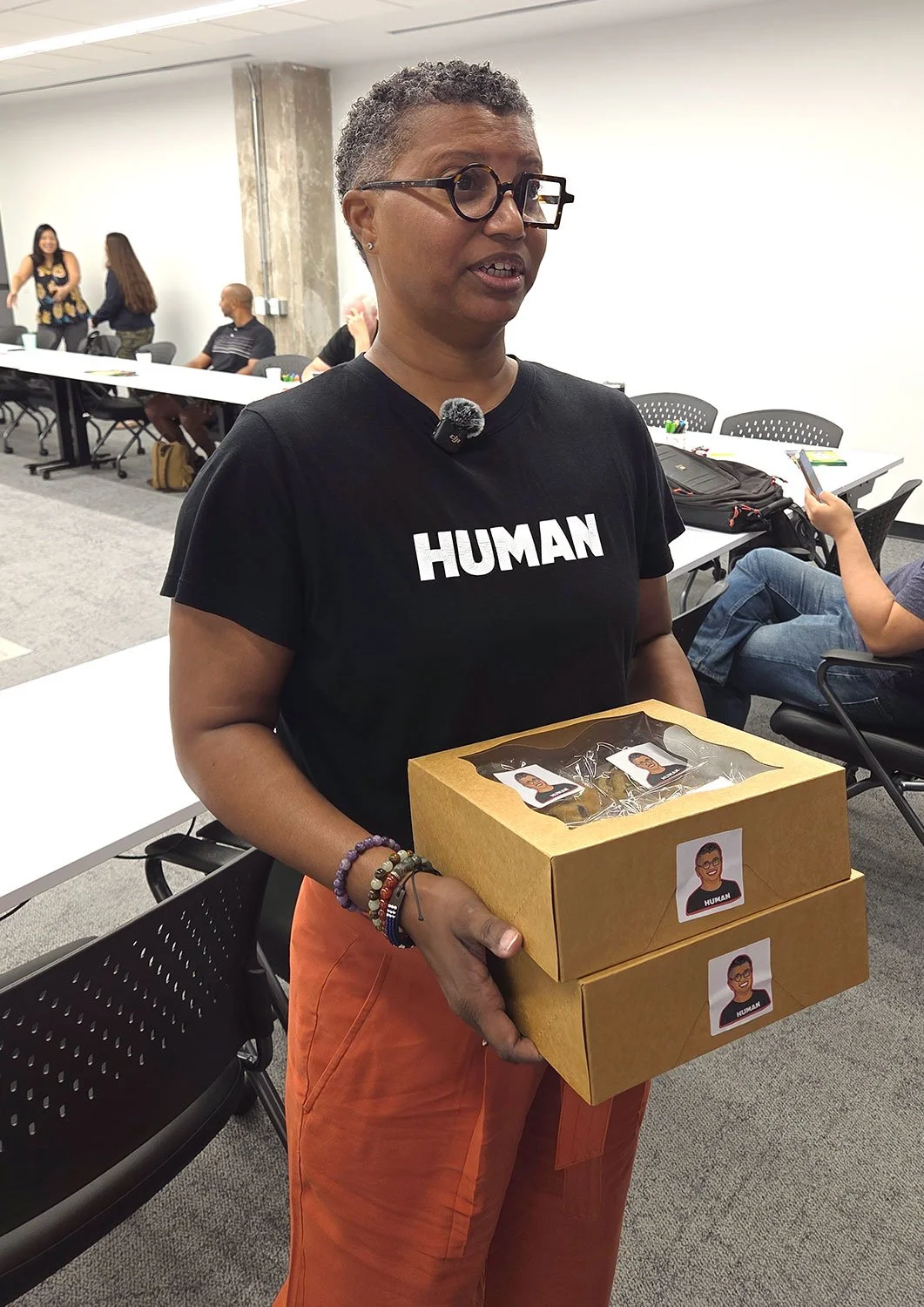 Tracie Jae with cookies and stickers with her portrait drawn by Peter Durand.